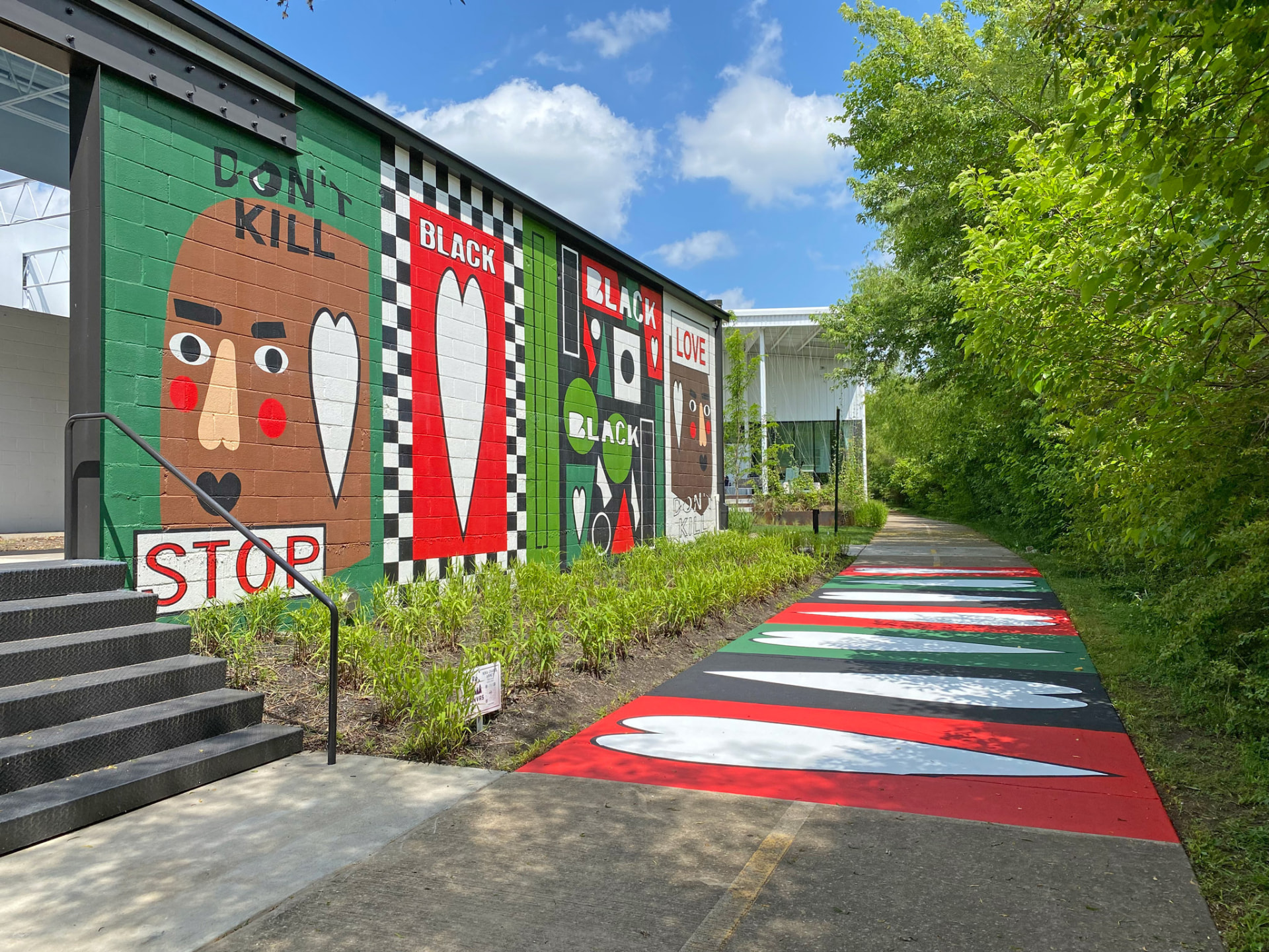 Mull It Over by Nina Chanel Abney, a colorful four-panel mural along the Razorback Greenway in Bentonville